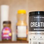 Creatine monohydrate from Jacked Factory displayed on a kitchen counter.