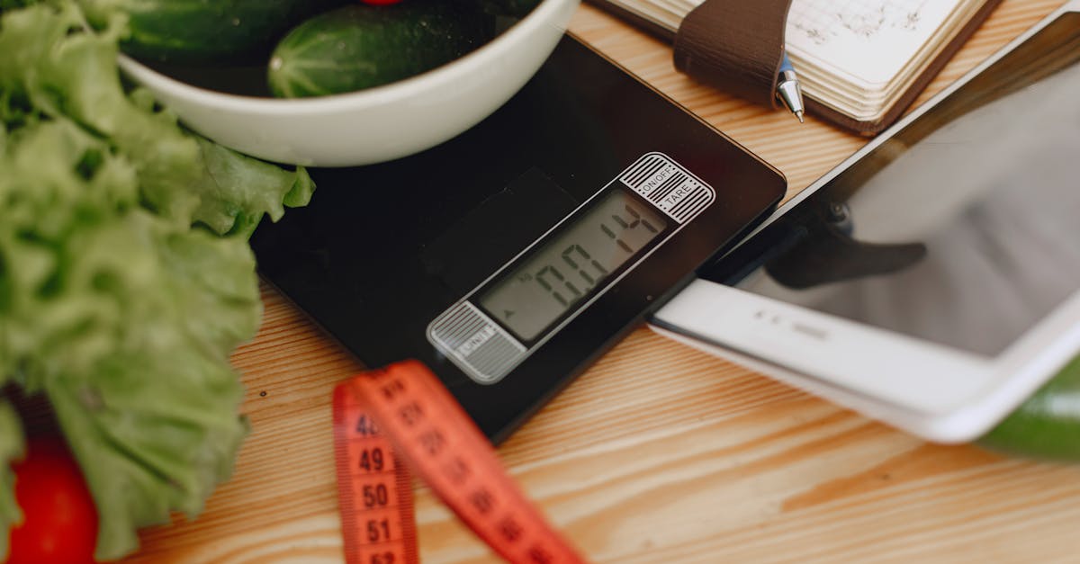 A bowl of fresh vegetables on a kitchen scale with measurement tools, depicting a healthy lifestyle.