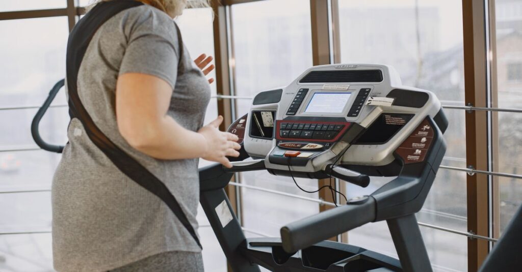 Woman exercising on treadmill in gym promoting healthy lifestyle and fitness.