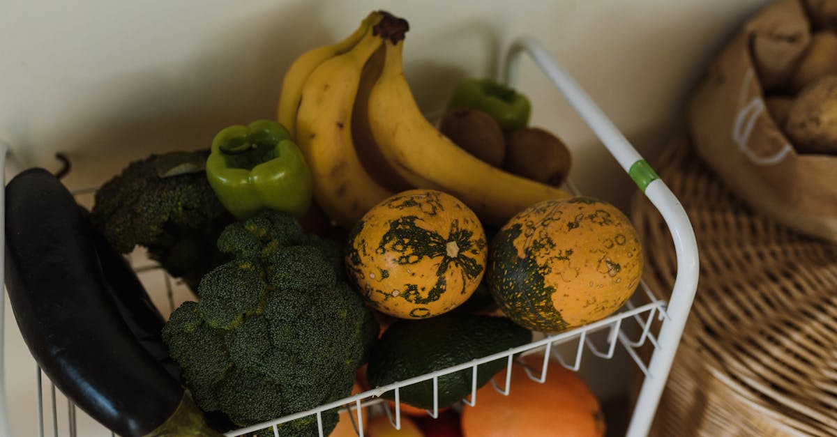A vibrant assortment of fruits and vegetables on a kitchen rack, showcasing health and nutrition.